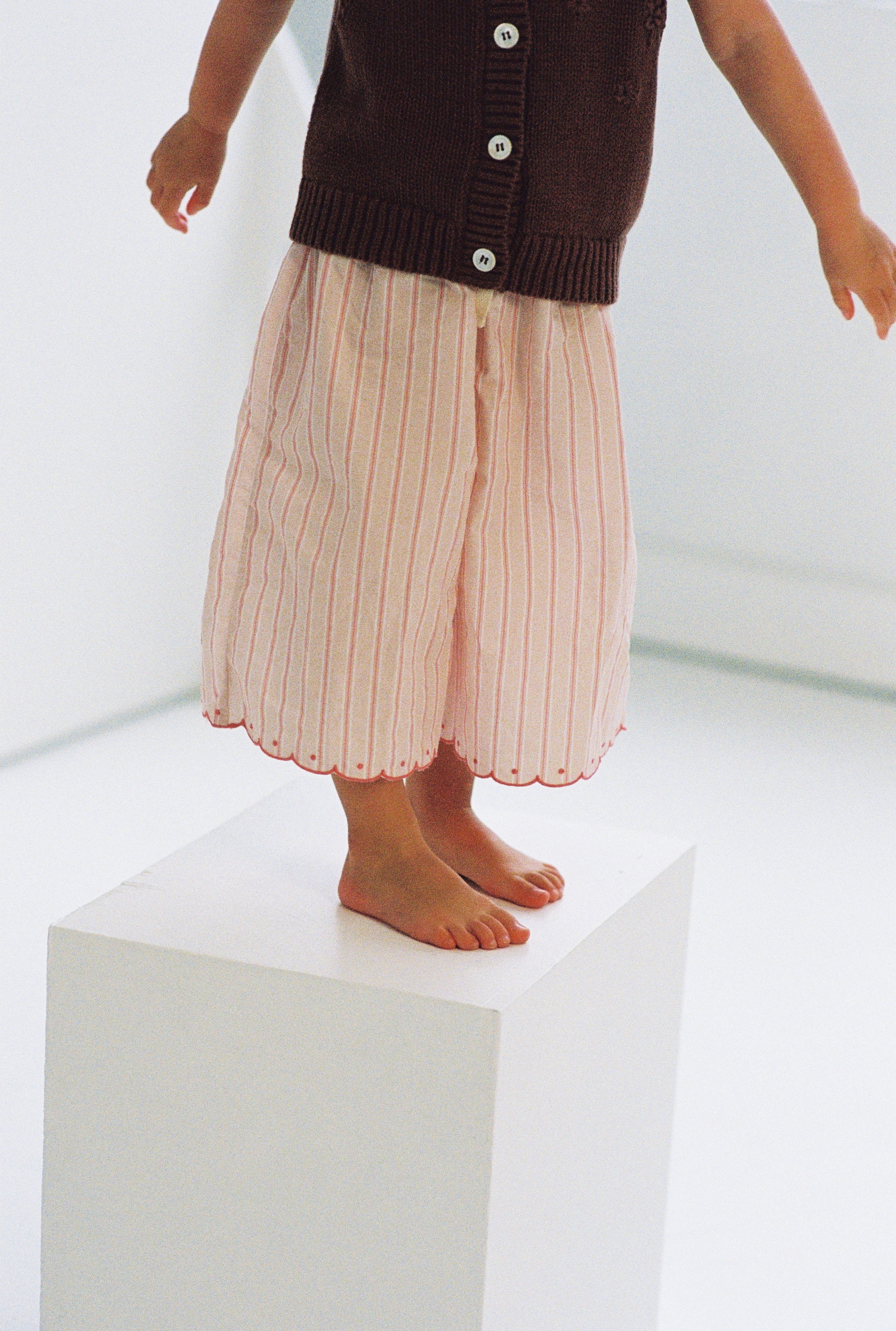 girls woven cotton wide leg pants with scalloped edging and pink stripe pattern