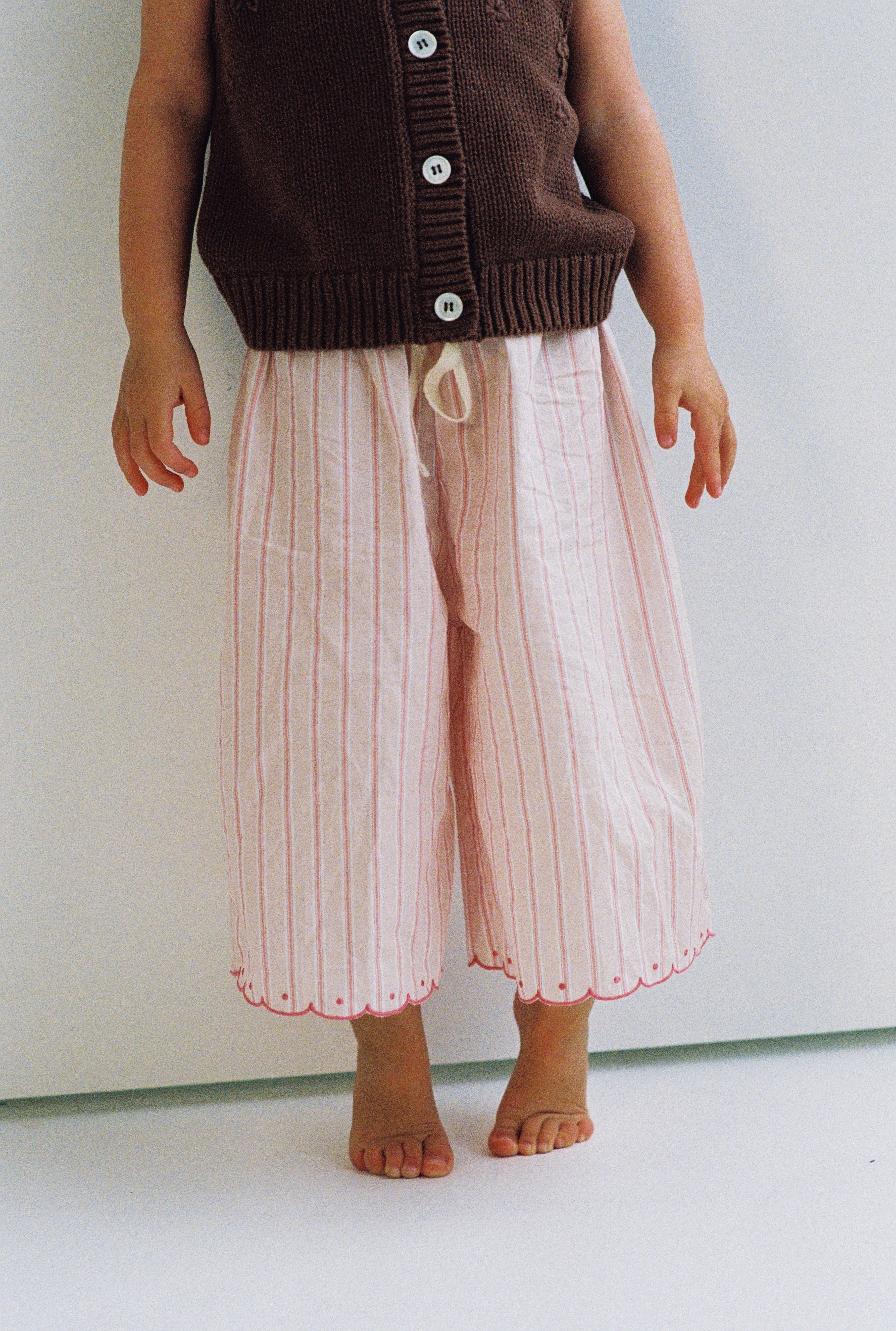 girls woven cotton wide leg pants with scalloped edging and pink stripe pattern