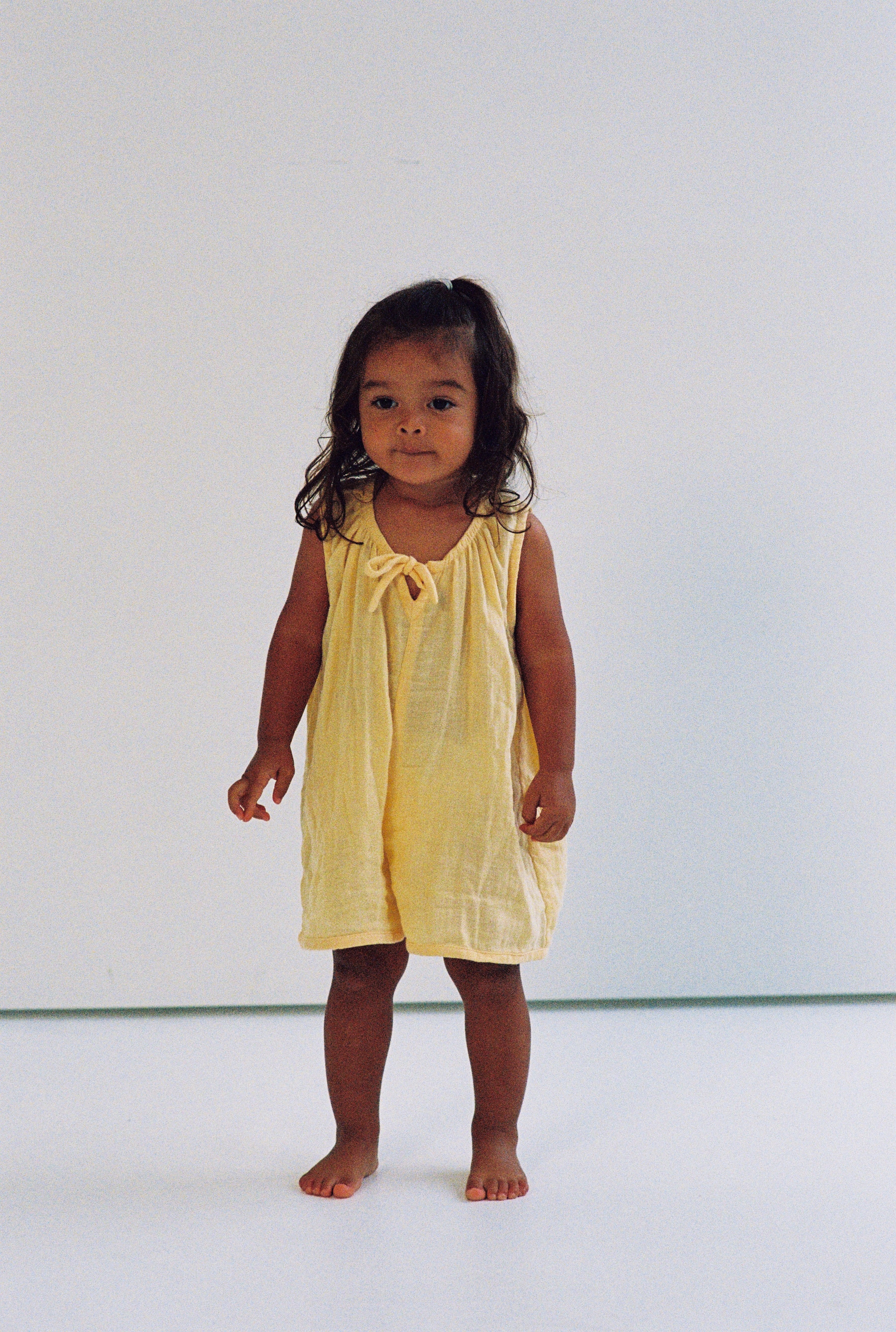 girls woven cotton overalls romper in butter yellow