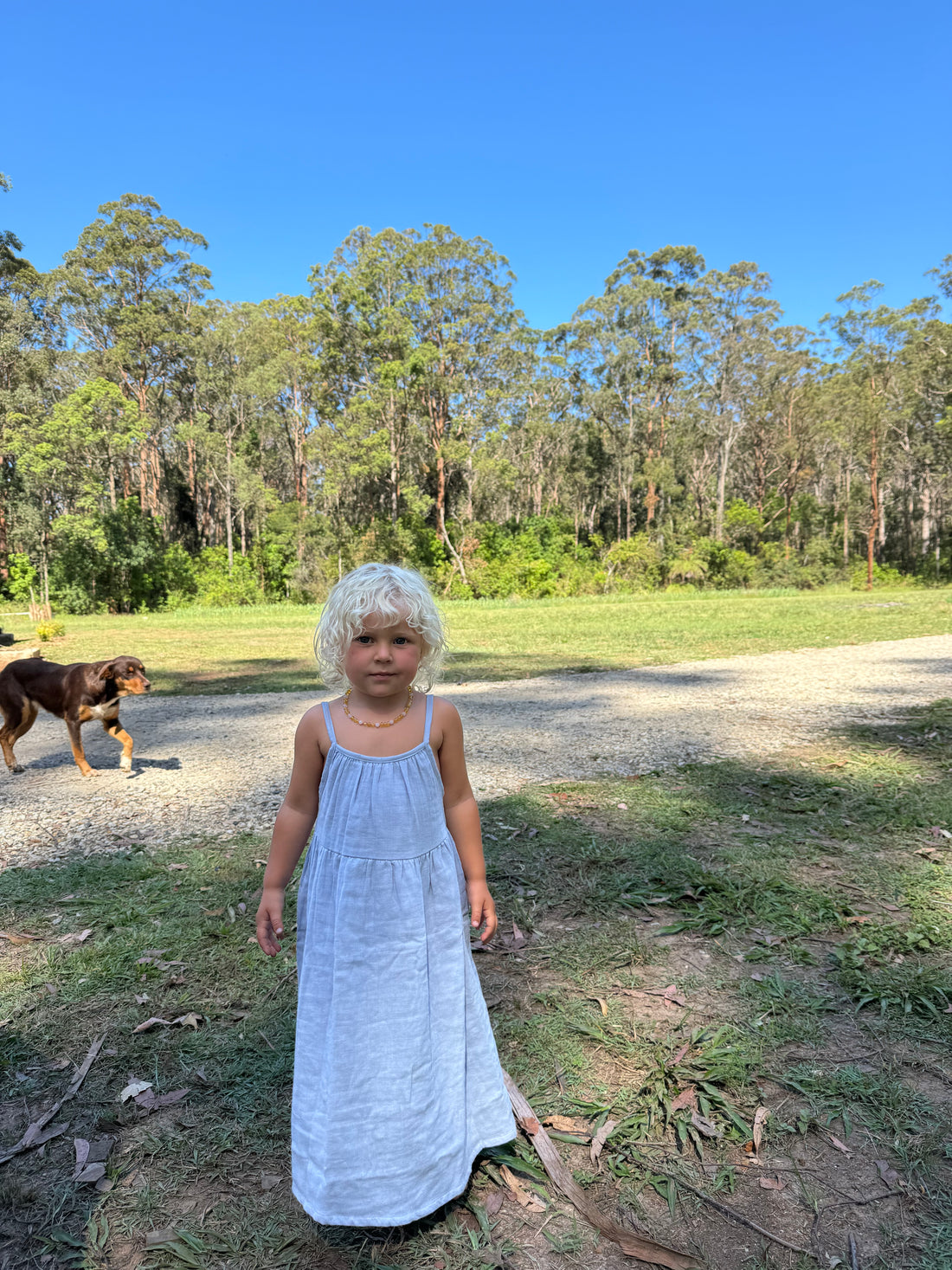 girl wearing woven cotton long dress in blue by illoura the label