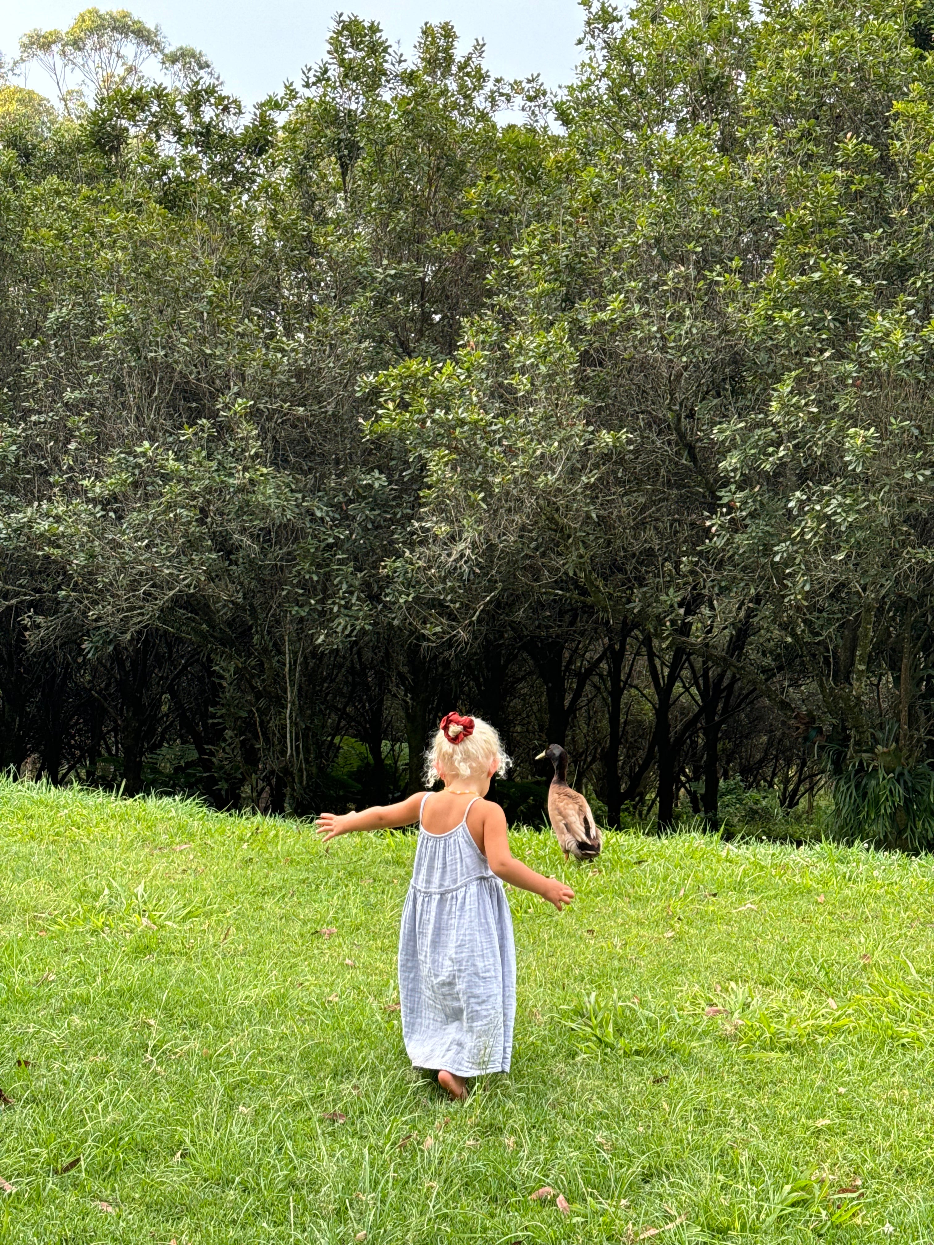 girl wearing woven cotton long dress in blue by illoura the label