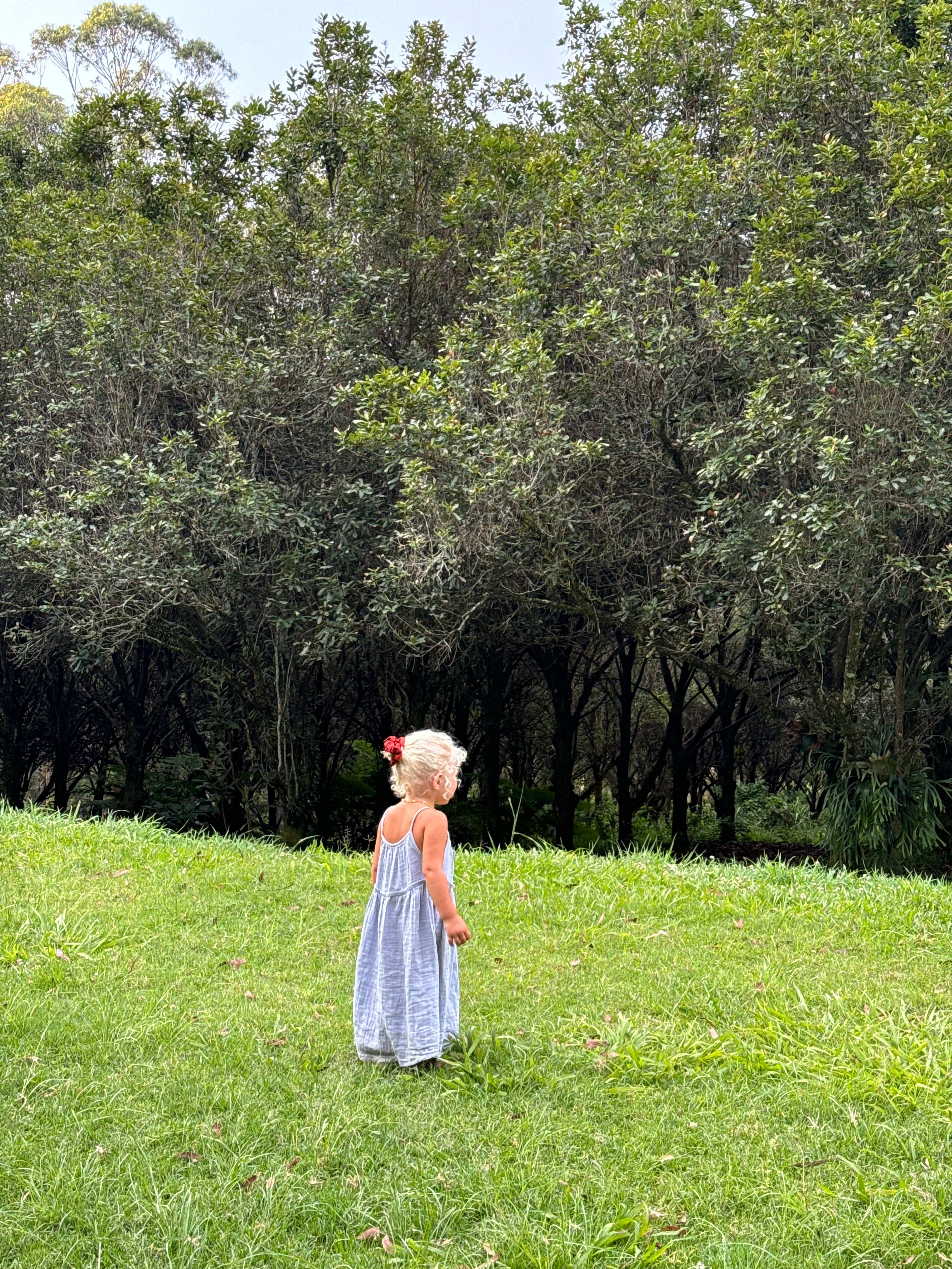 girl wearing woven cotton long dress in blue by illoura the label