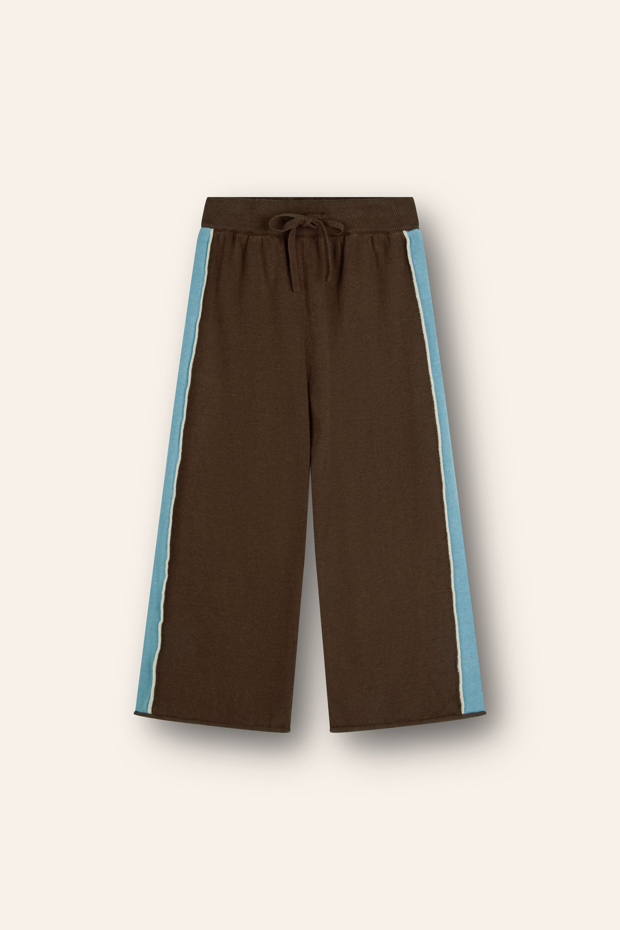 linen/ cotton blend knit pants in chocolate brown with blue panels up the side and white piping, an elasticated waistband and functional tie