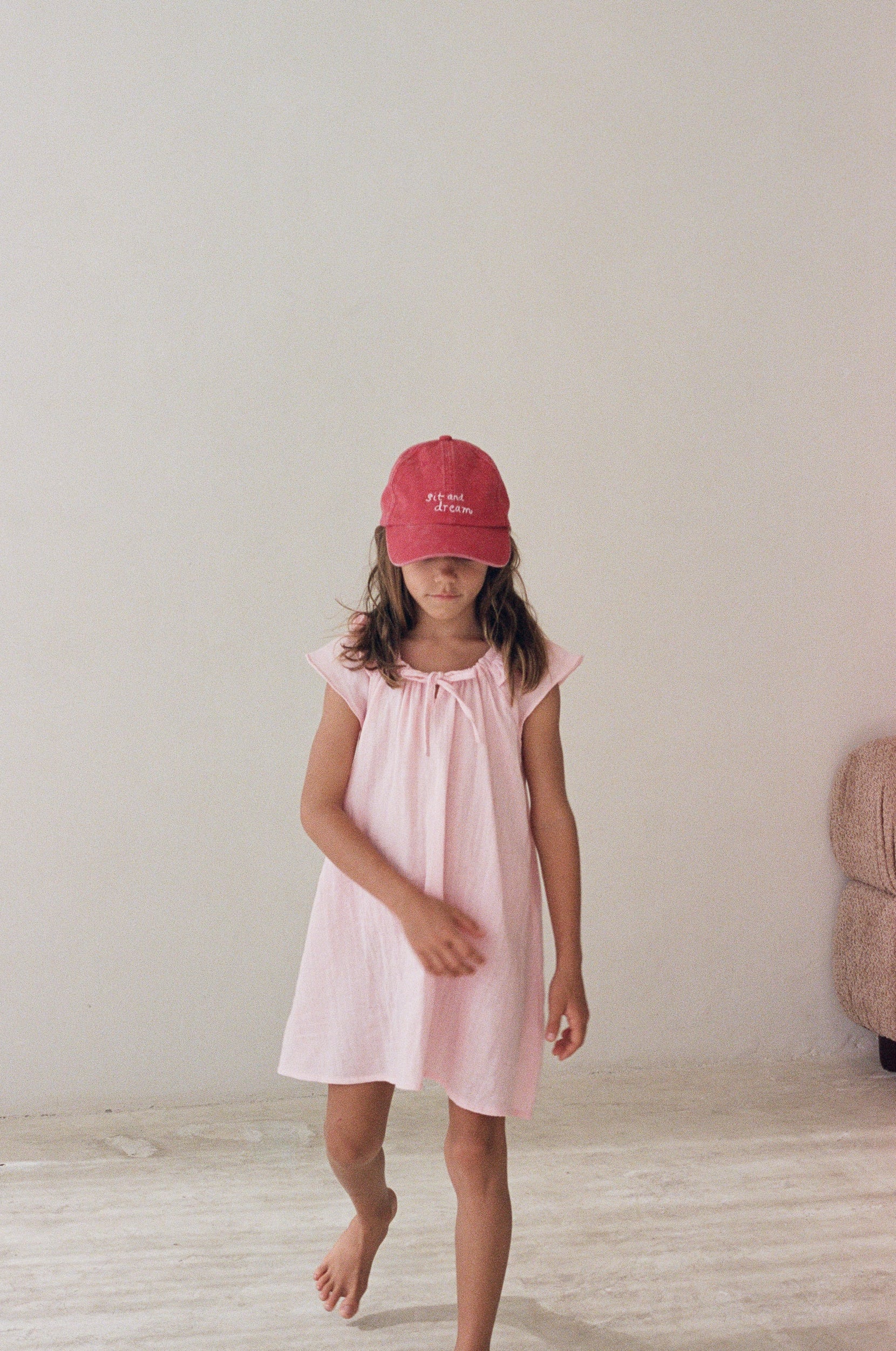 girl wearing cotton canvas cap washed red by Illoura the label