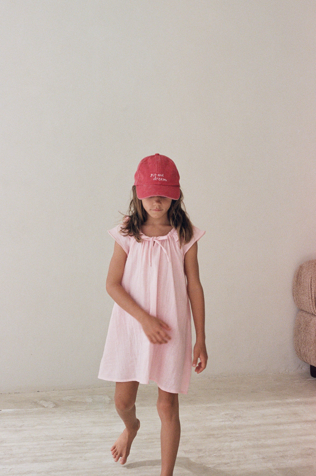 girl wearing cotton canvas cap washed red by Illoura the label