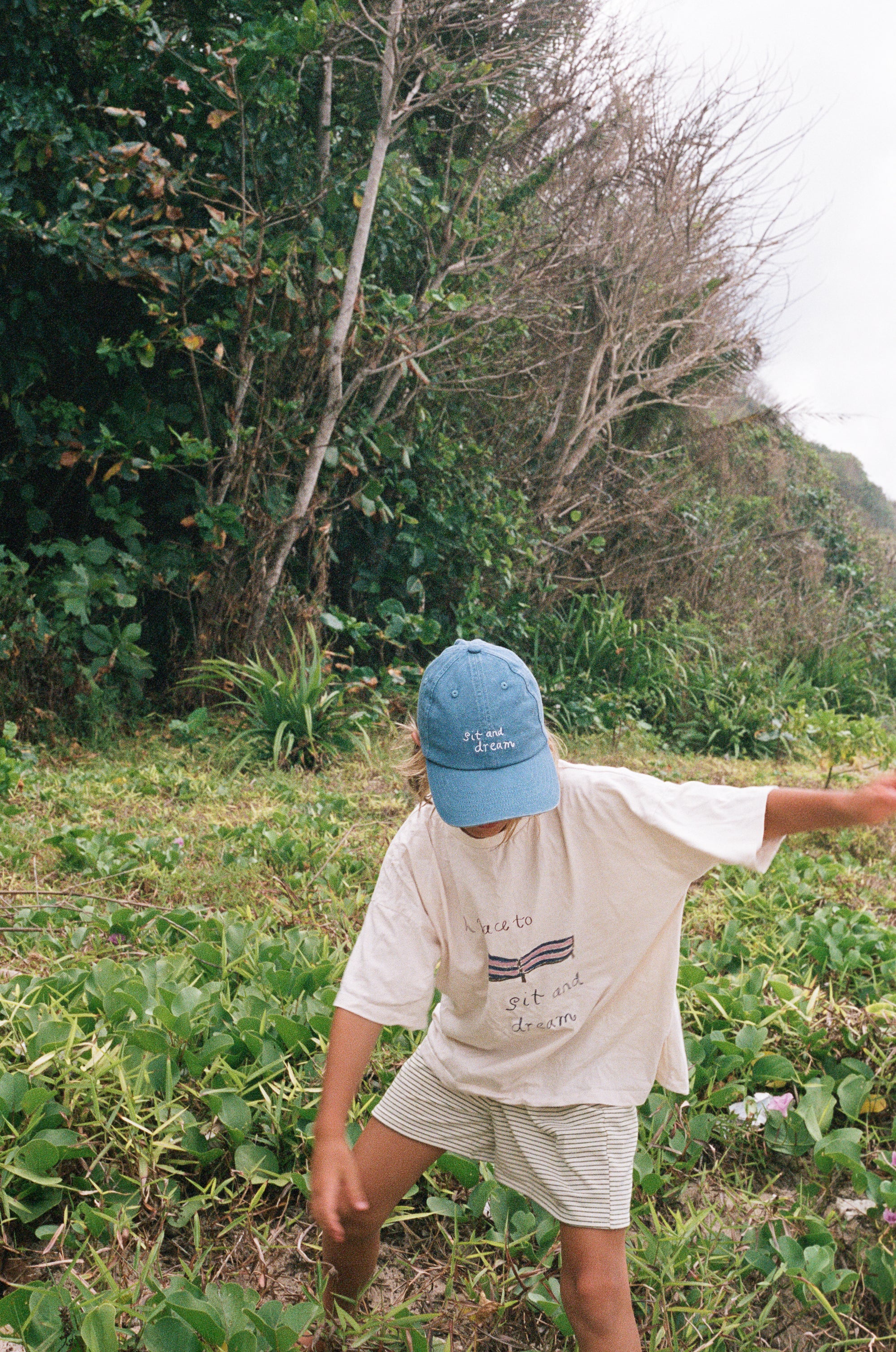 boy wearing cotton jersey stripe shorts and sit and dream t-shirt by Illoura the label