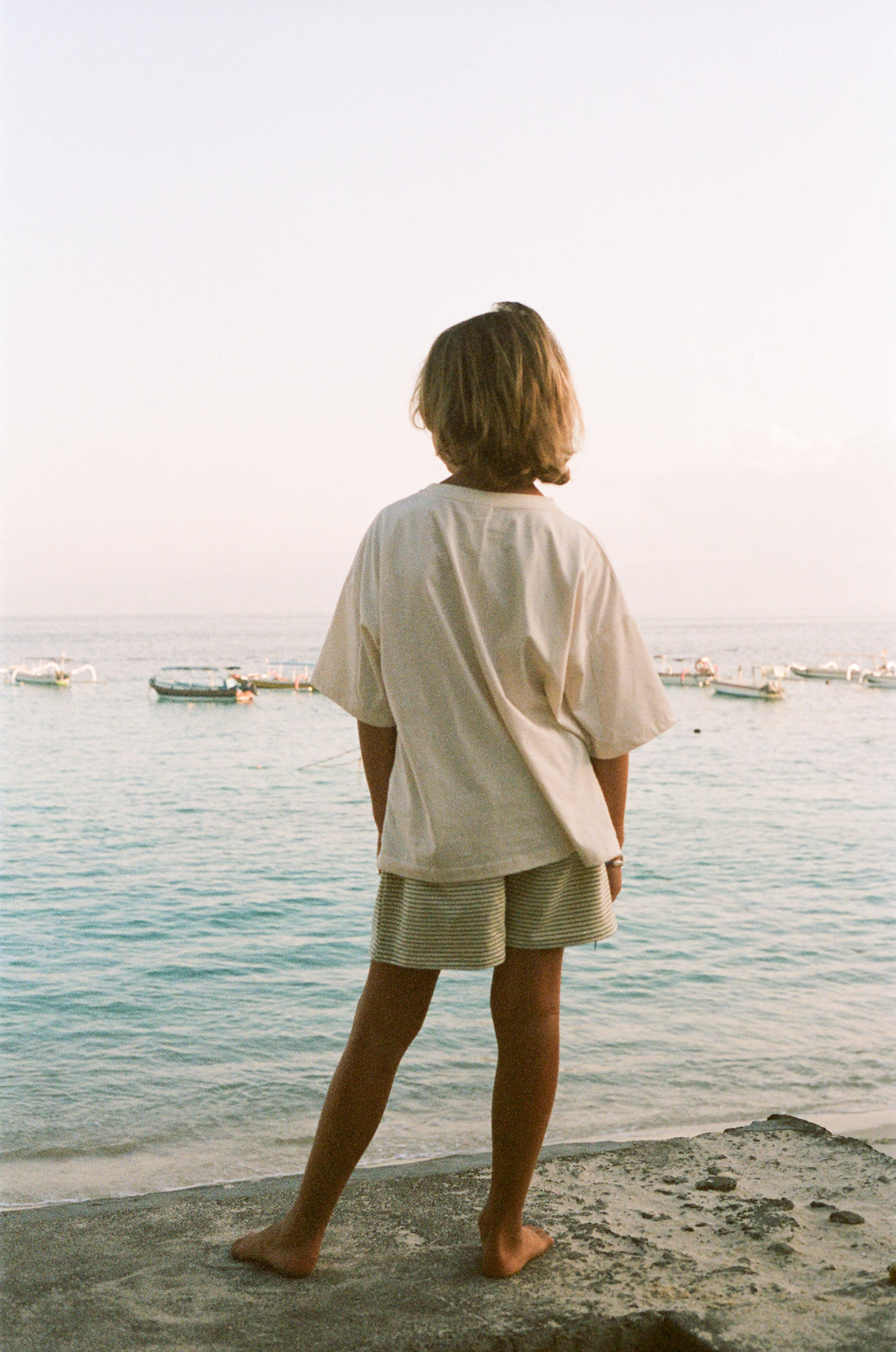 boy wearing cotton jersey stripe shorts and sit and dream t-shirt by Illoura the label