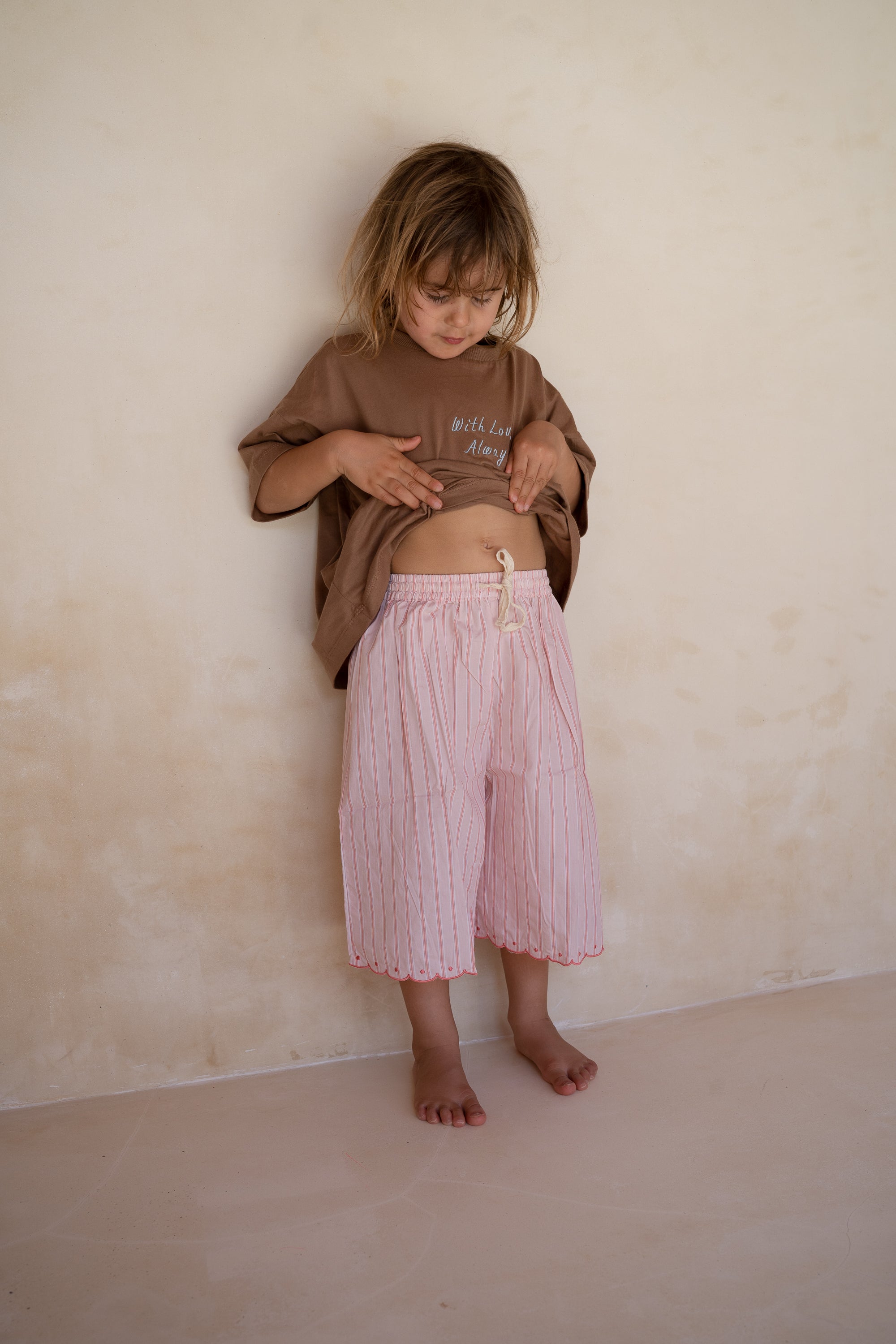 girls woven cotton wide leg pants with scalloped edging and pink stripe pattern