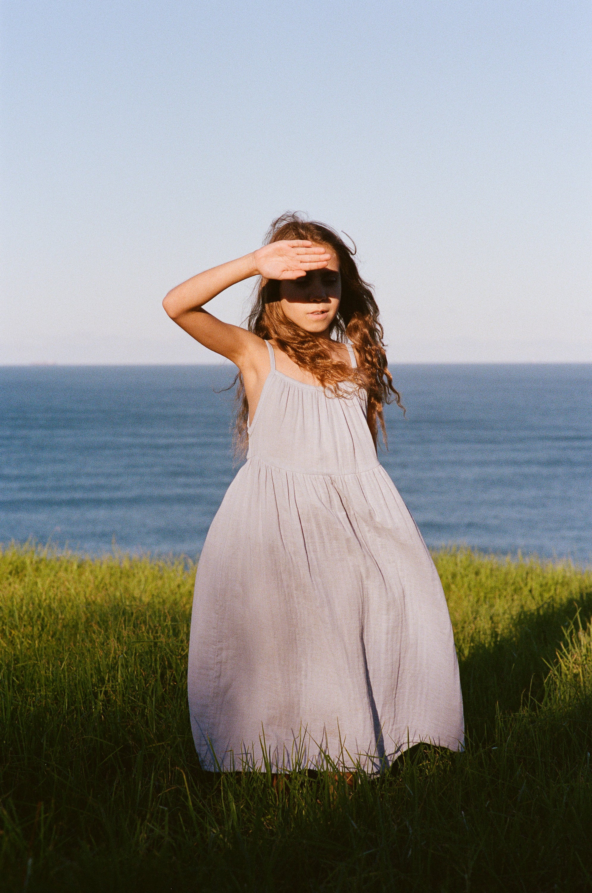 girl wearing woven cotton long dress in blue by illoura the label