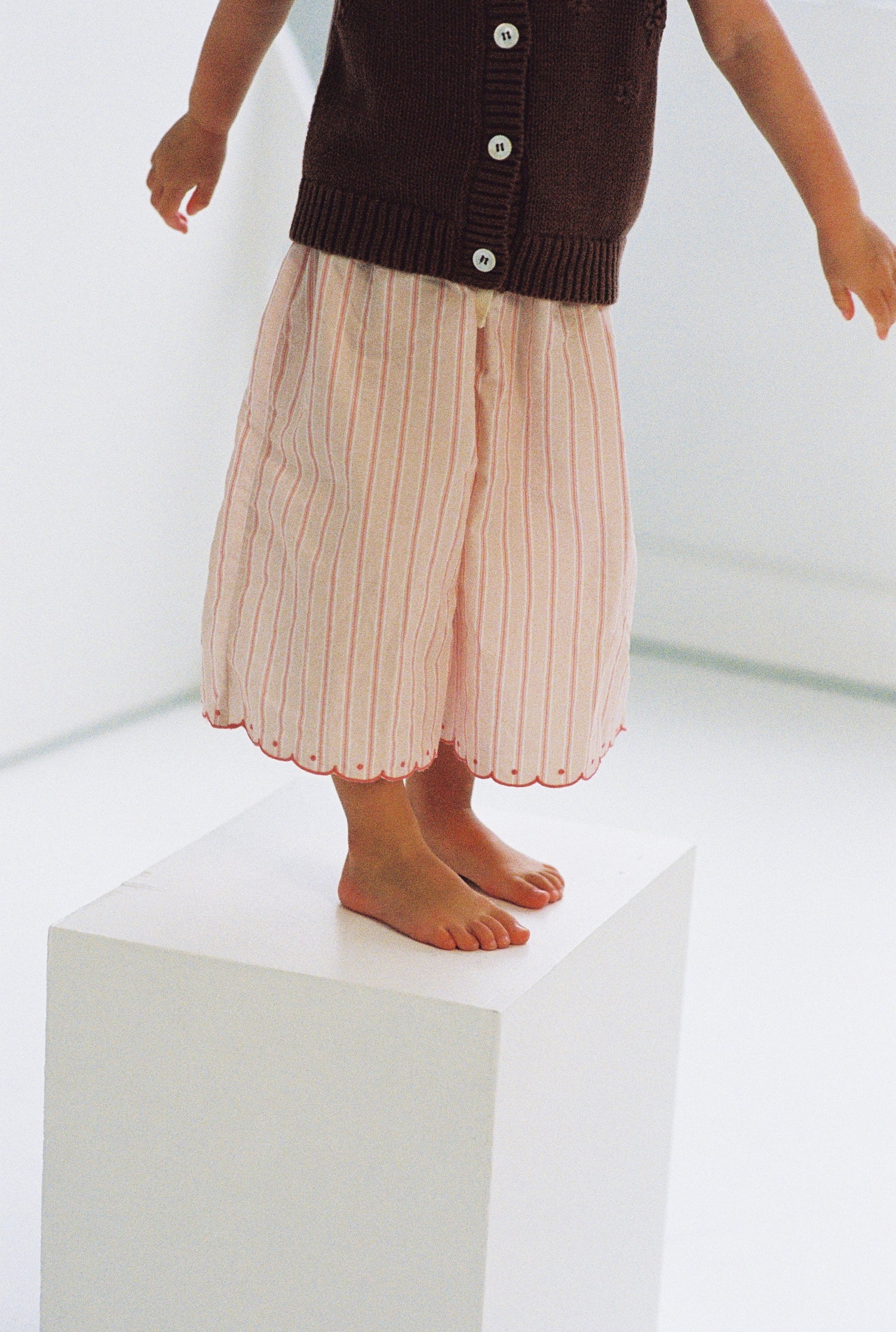 girls woven cotton wide leg pants with scalloped edging and pink stripe pattern