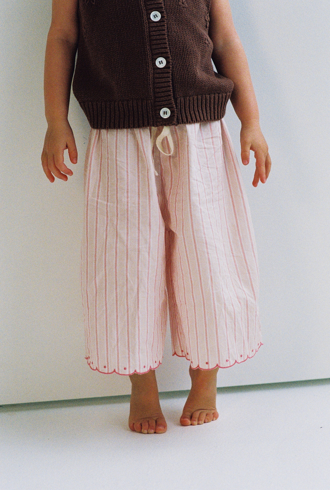 girls woven cotton wide leg pants with scalloped edging and pink stripe pattern