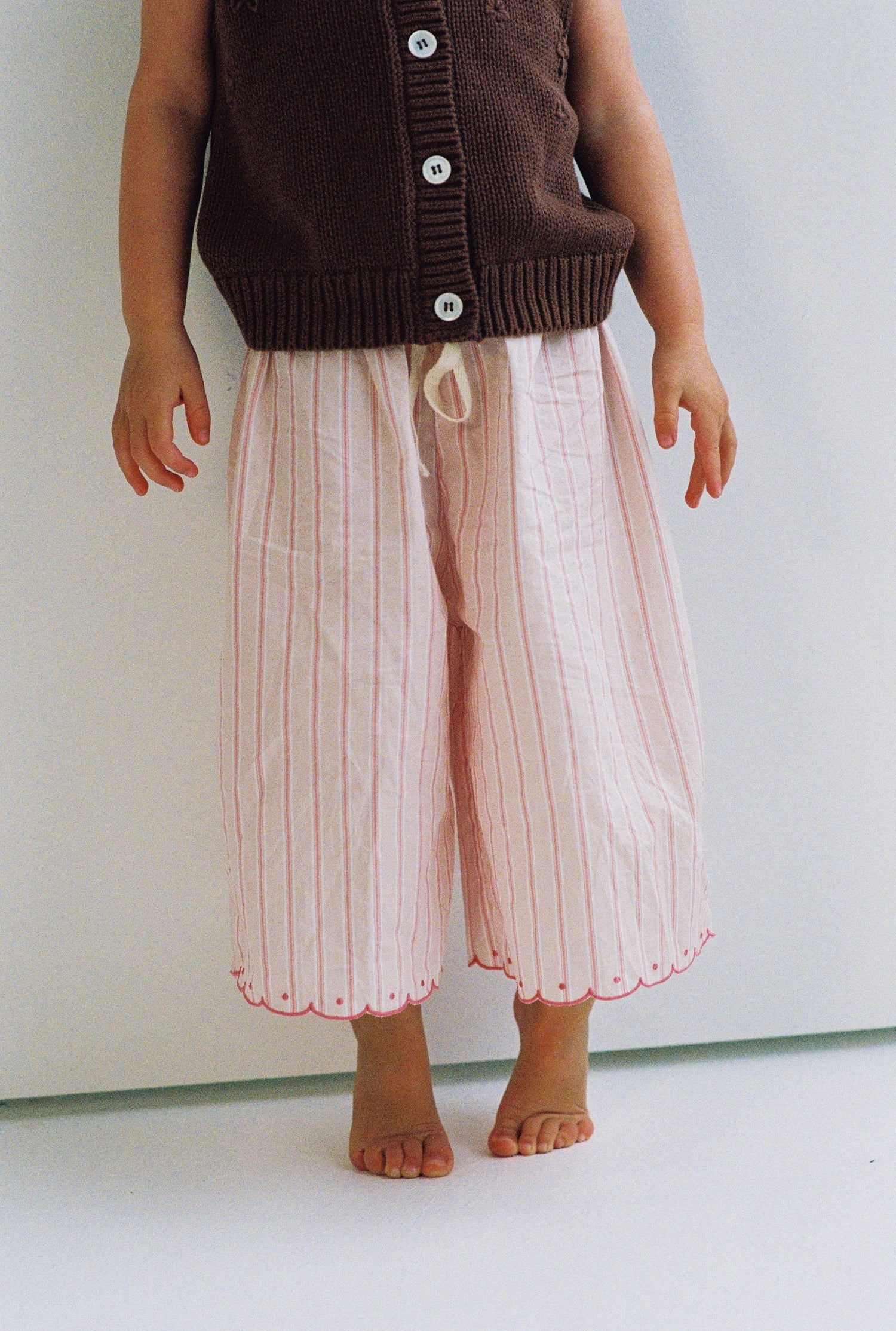 girls woven cotton wide leg pants with scalloped edging and pink stripe pattern