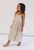 girl wearing 3/4 length floral printed dress made from 100% cotton poplin with thin straps and gathers at the chest and waist