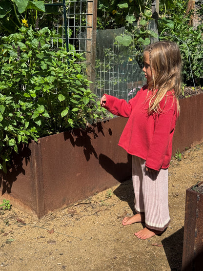 Child wearing Illoura organic cotton essential knit jumper and pants