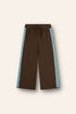 linen/ cotton blend knit pants in chocolate brown with blue panels up the side and white piping, an elasticated waistband and functional tie