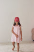 girl wearing cotton canvas cap washed red by Illoura the label