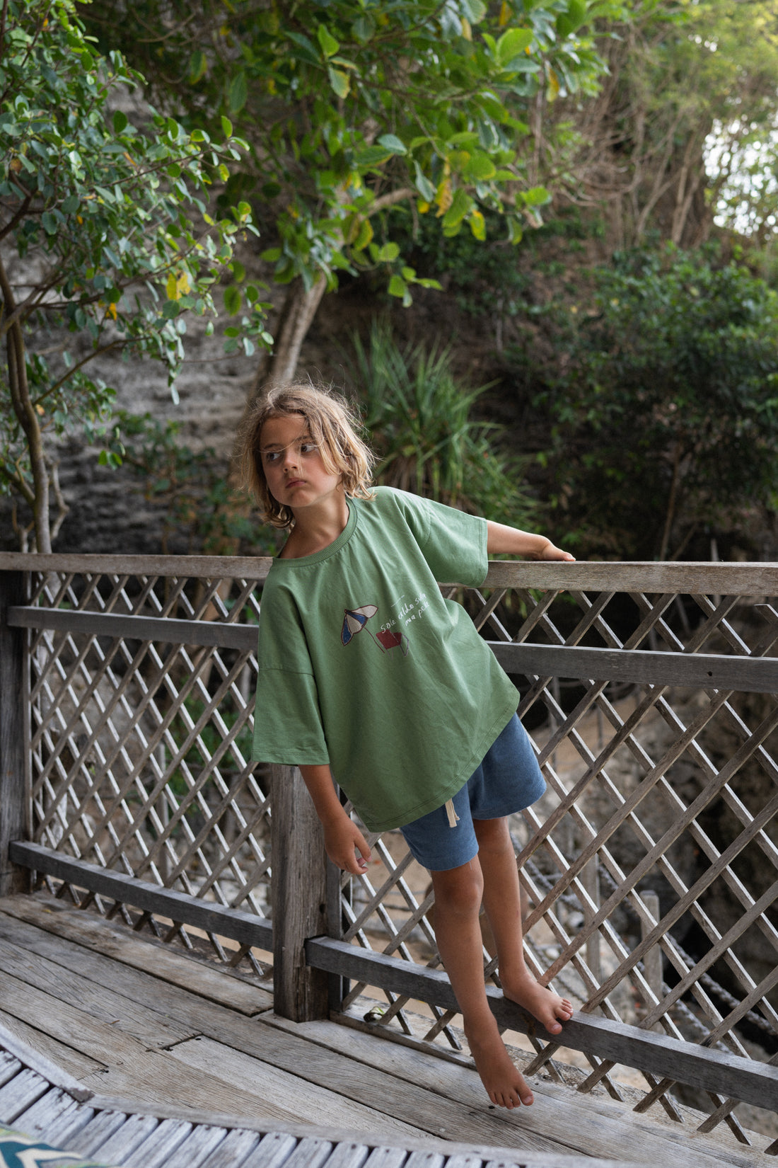 boy wearing blue cotton terry shorts and green t-shirt by Illoura the label
