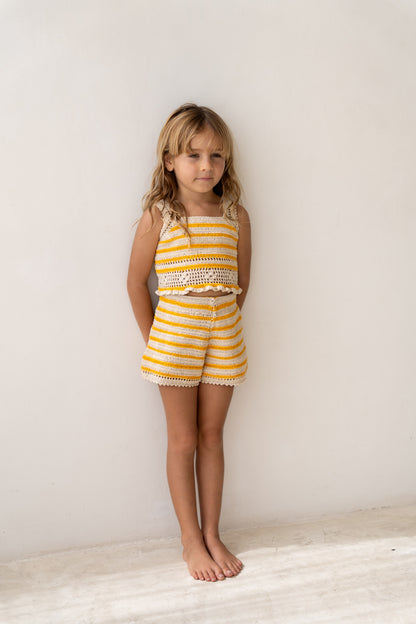 girl wearing handmade cotton crochet top and shorts by Illoura the label