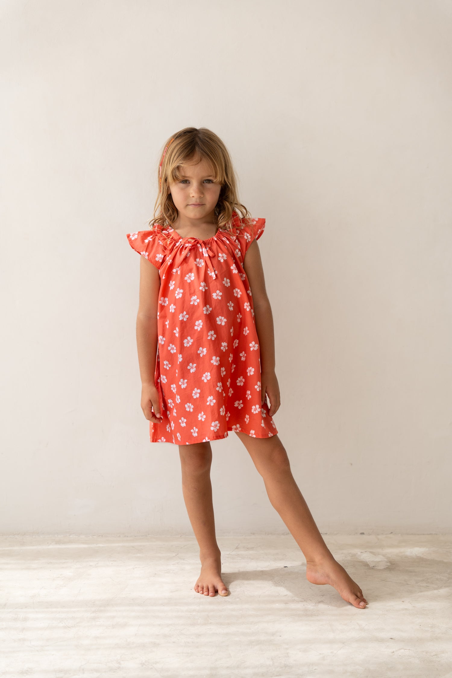 girl wearing cotton floral printed dress by Illoura the label