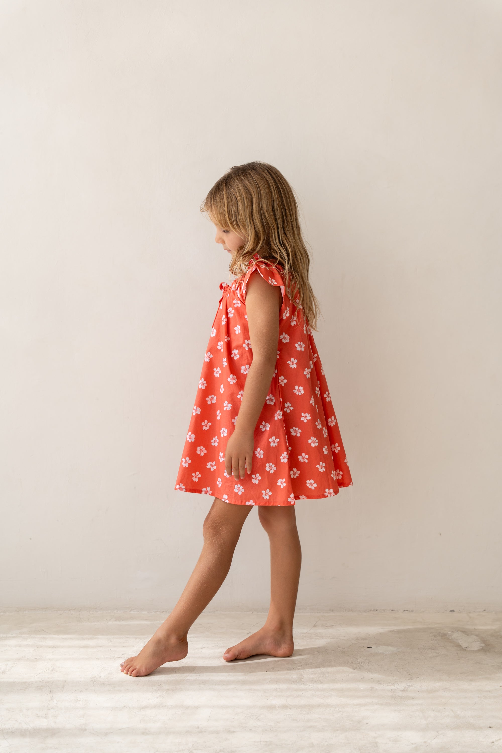 girl wearing cotton floral printed dress by Illoura the label