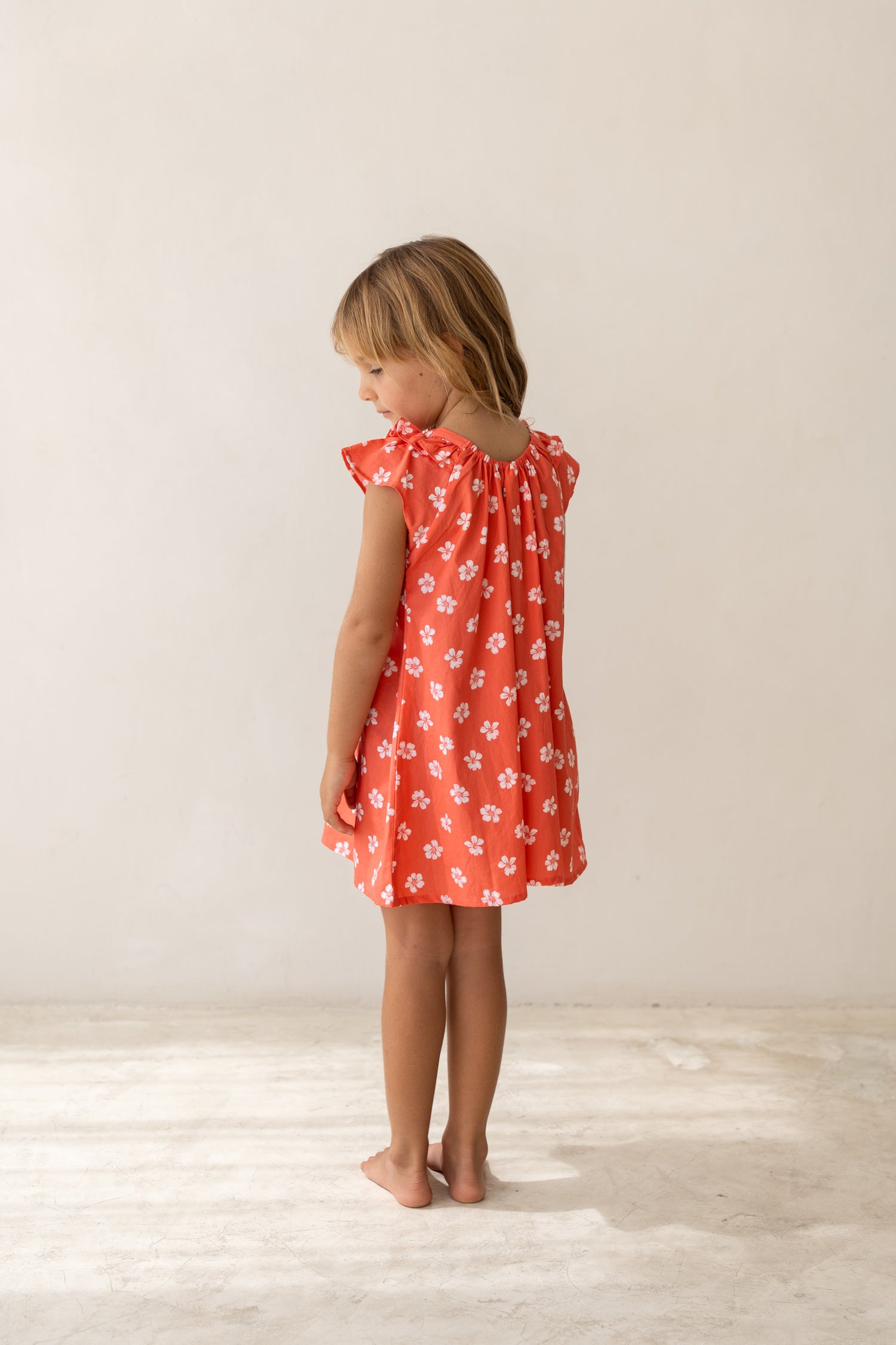 girl wearing cotton floral printed dress by Illoura the label