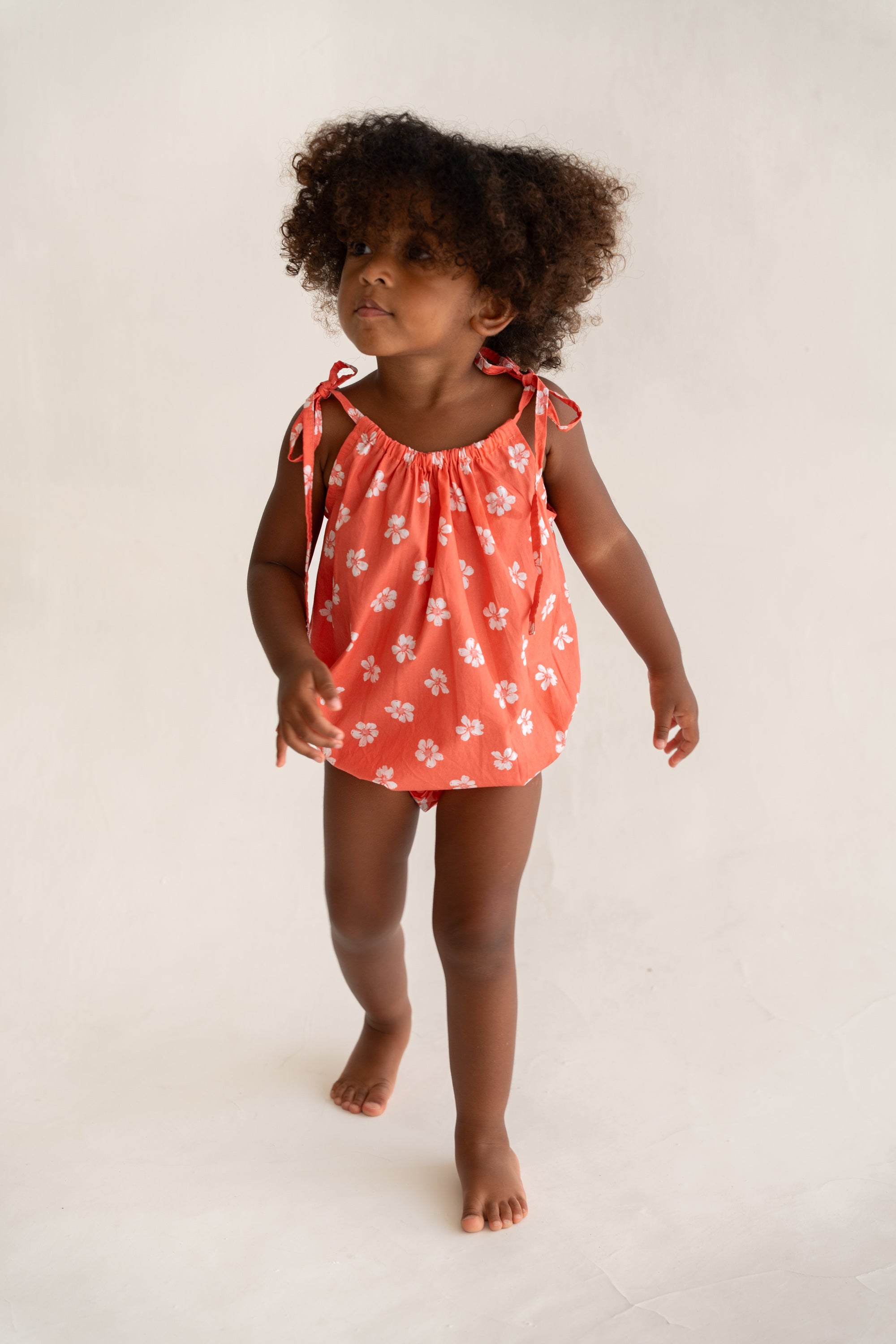 toddler girl wearing cotton floral printed romper by Illoura the label