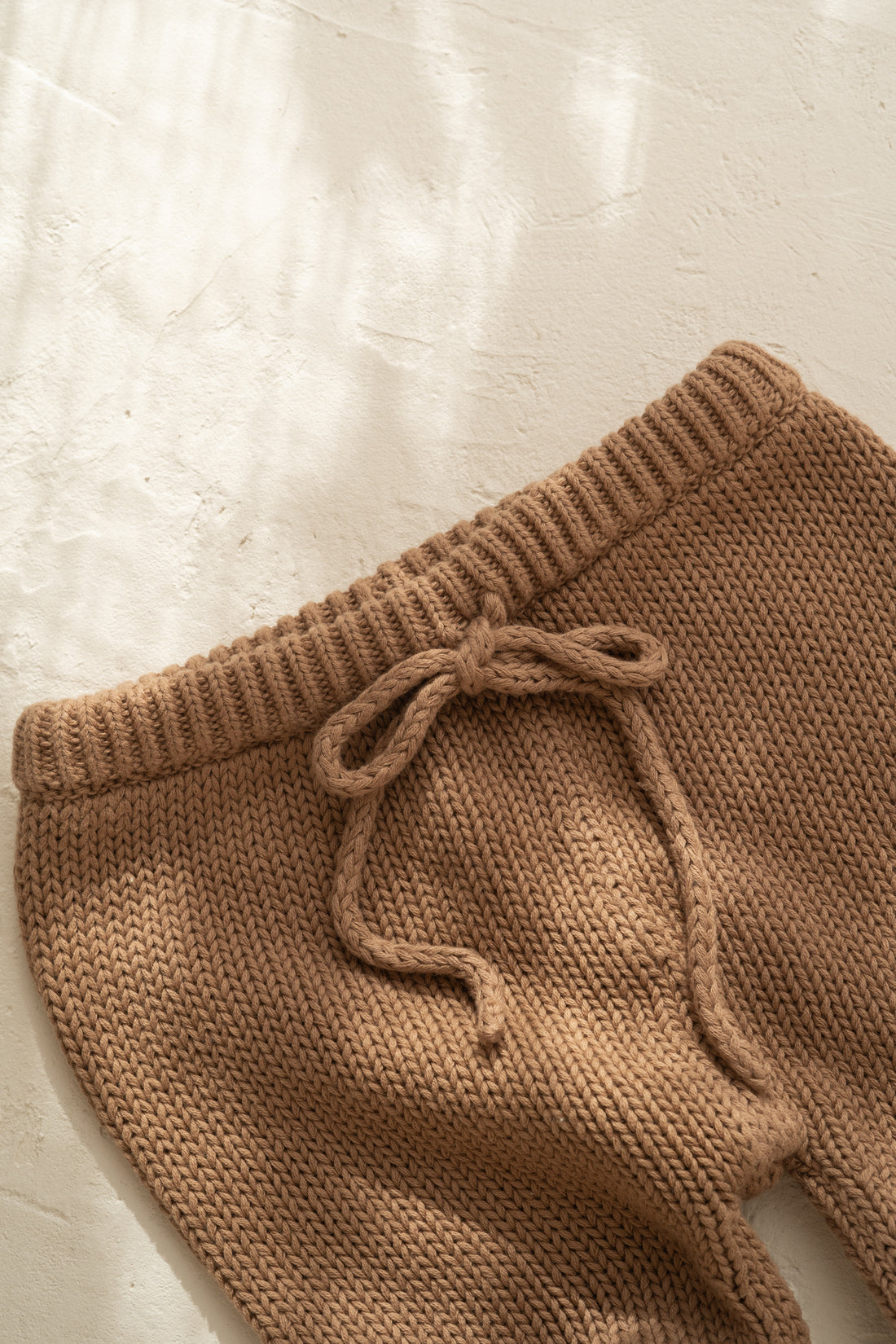 Knitted cotton baby pants. Chocolate colour